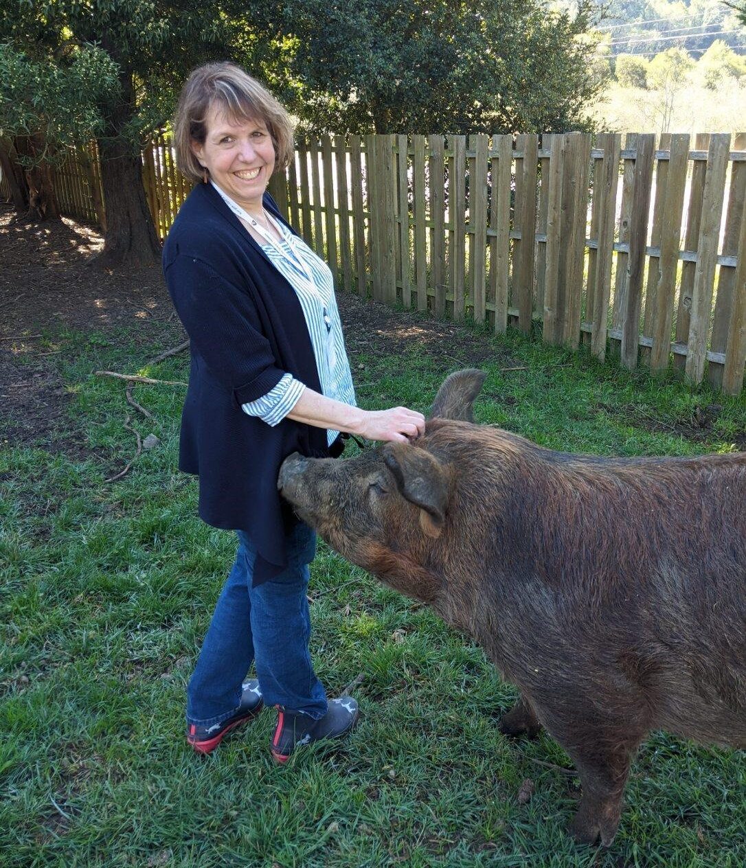 Stacey with a pig