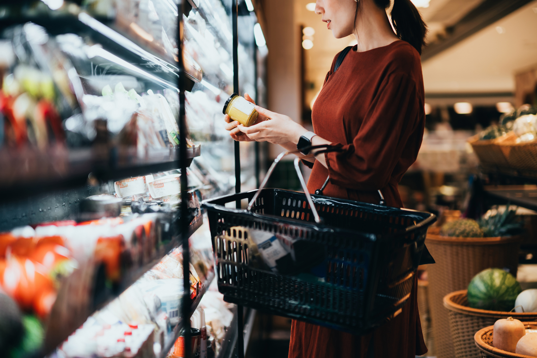 woman reading a product label